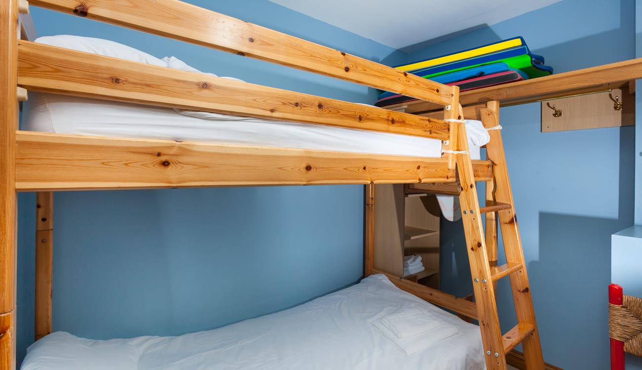 The bunk bedroom is a fun space for the kids to play and relax.