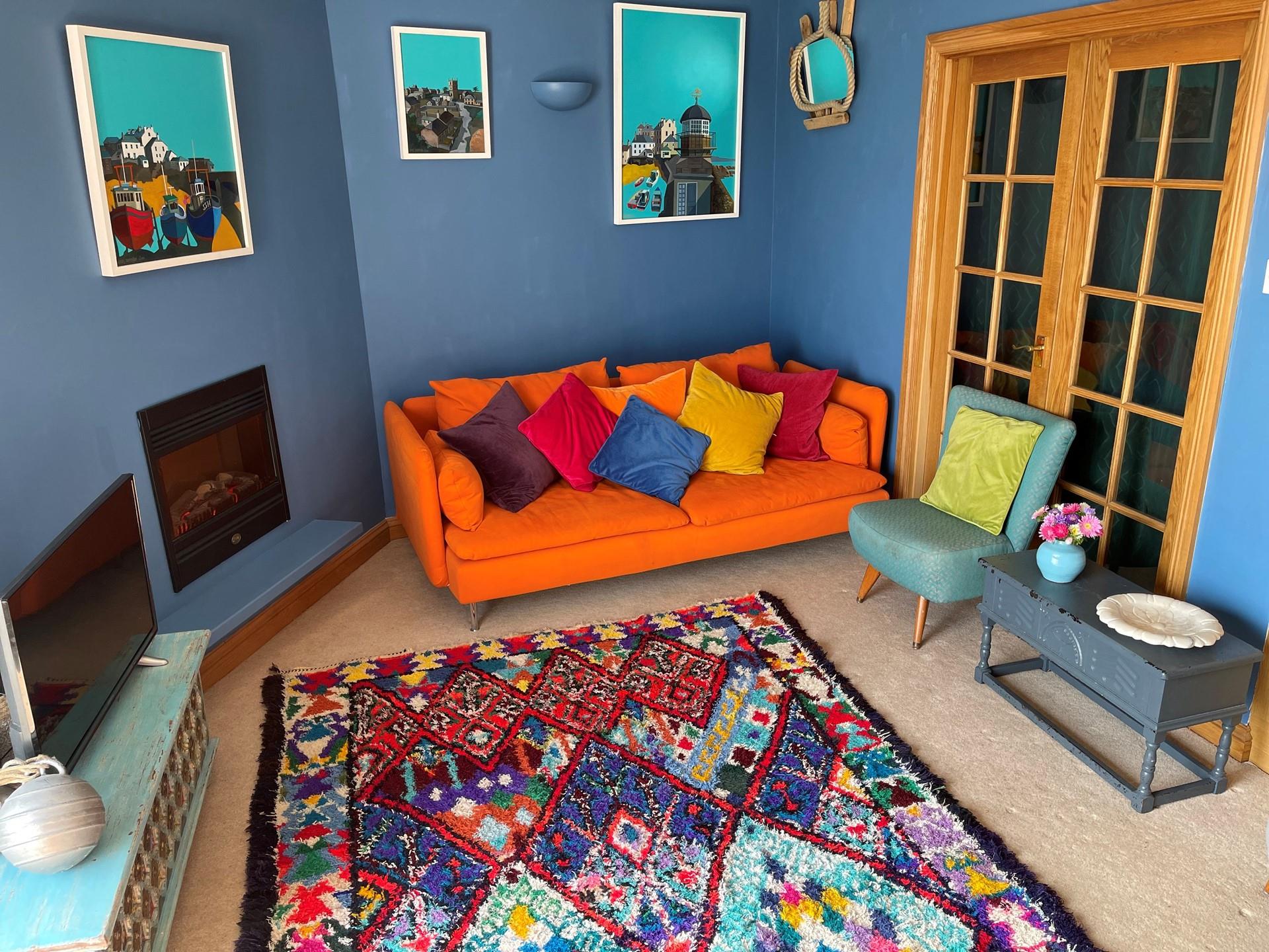 The colourful sitting room is a bright and welcoming space.