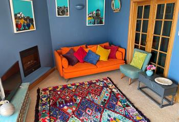 The colourful sitting room is a bright and welcoming space.