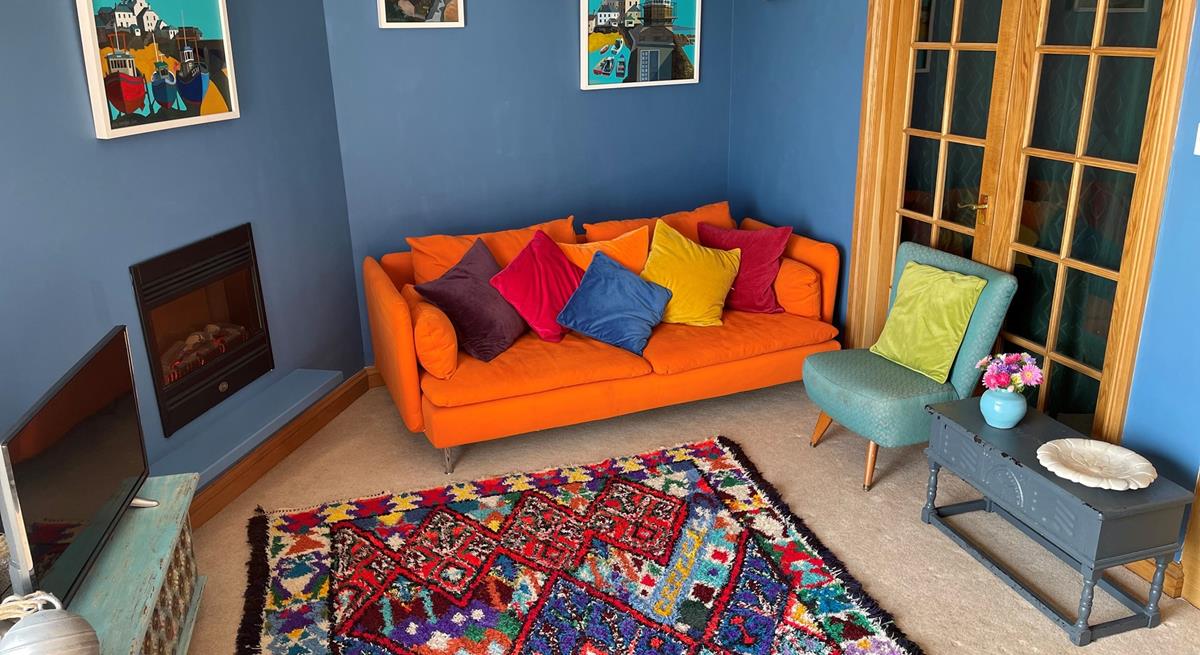 The colourful sitting room is a bright and welcoming space.