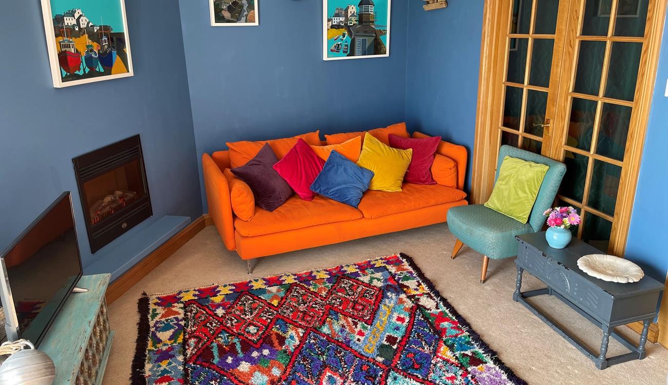 The colourful sitting room is a bright and welcoming space.