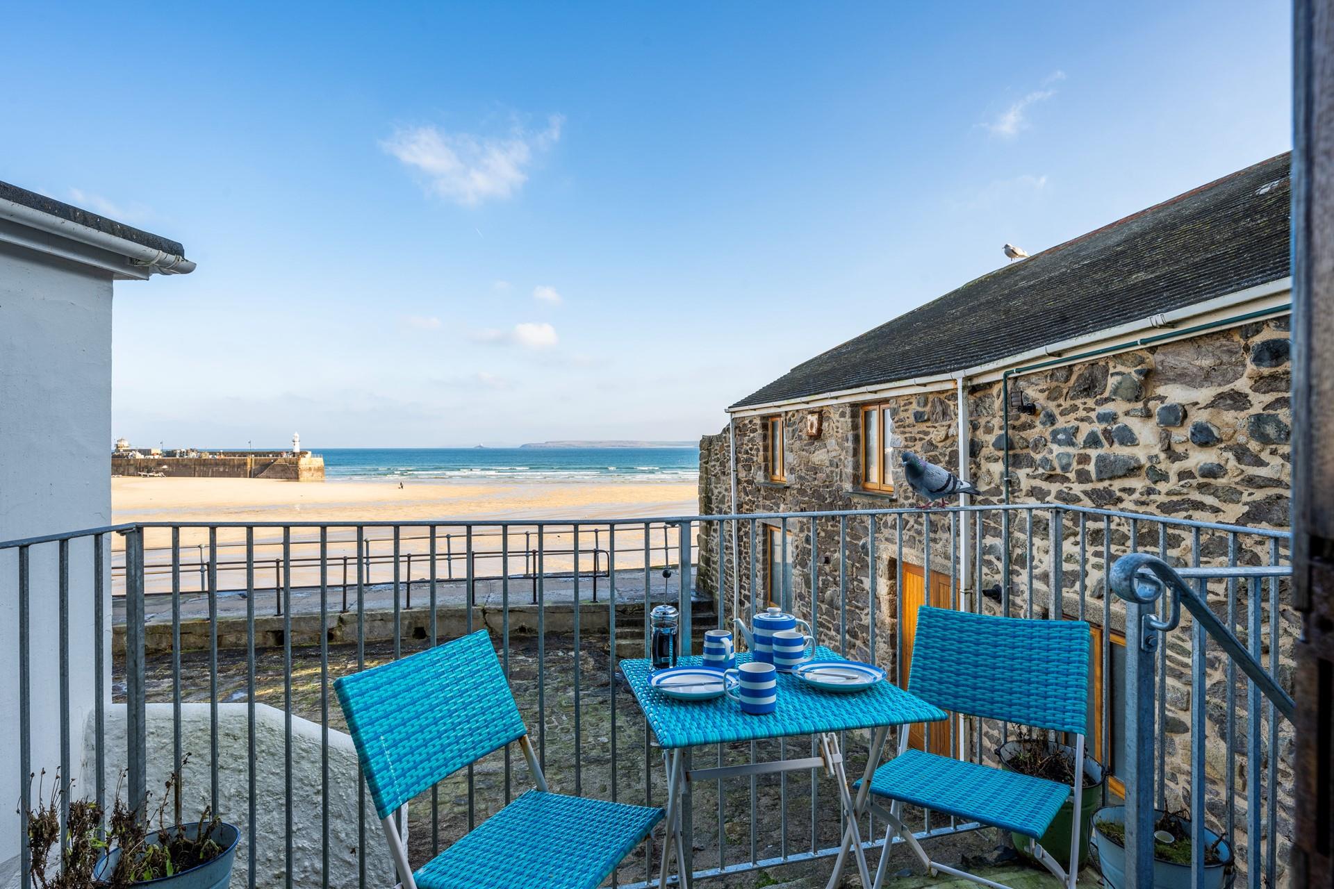 Enjoy afternoon tea in the sunshine with enviable views of St Ives.