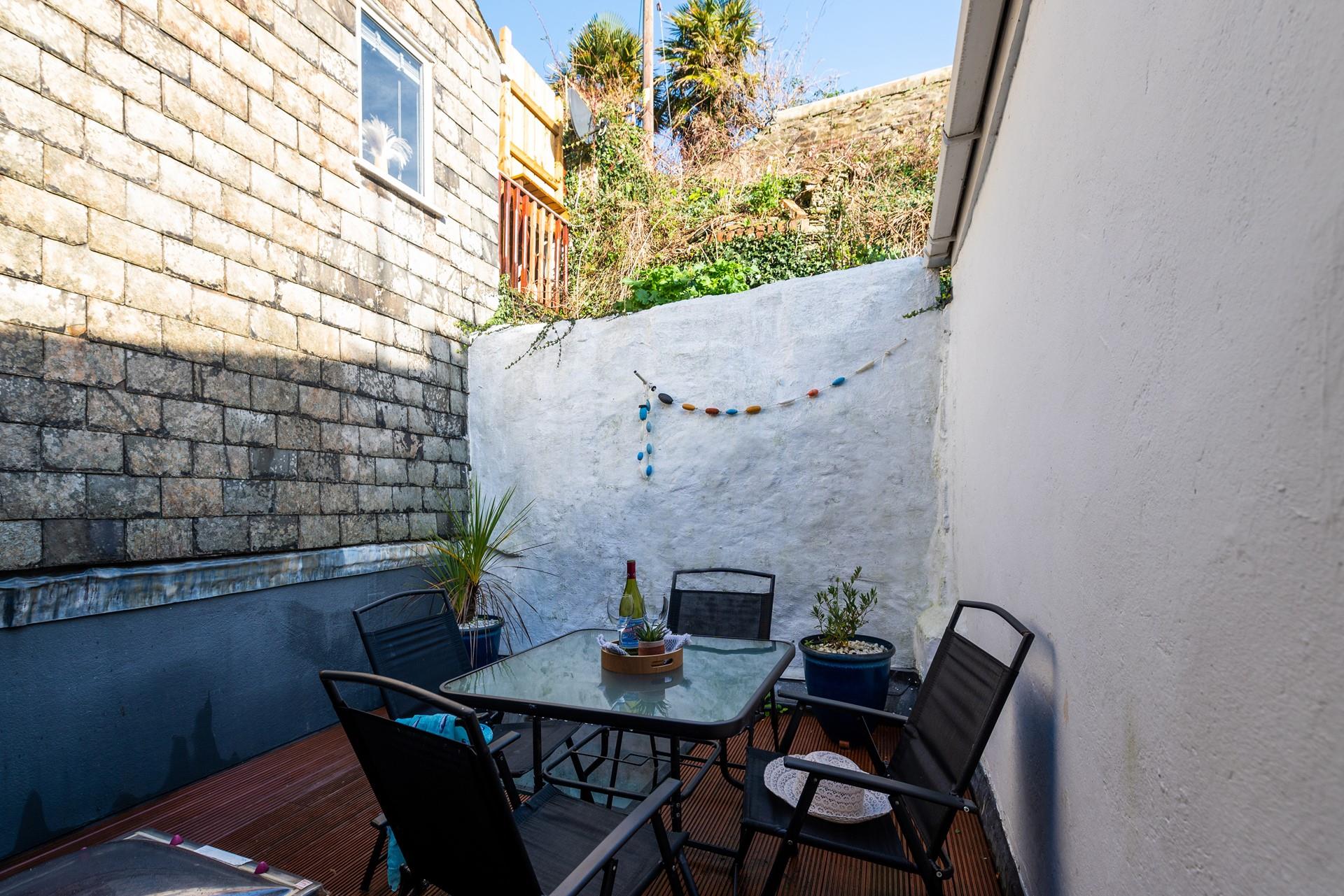 Open a bottle of wine and relax in your courtyard.