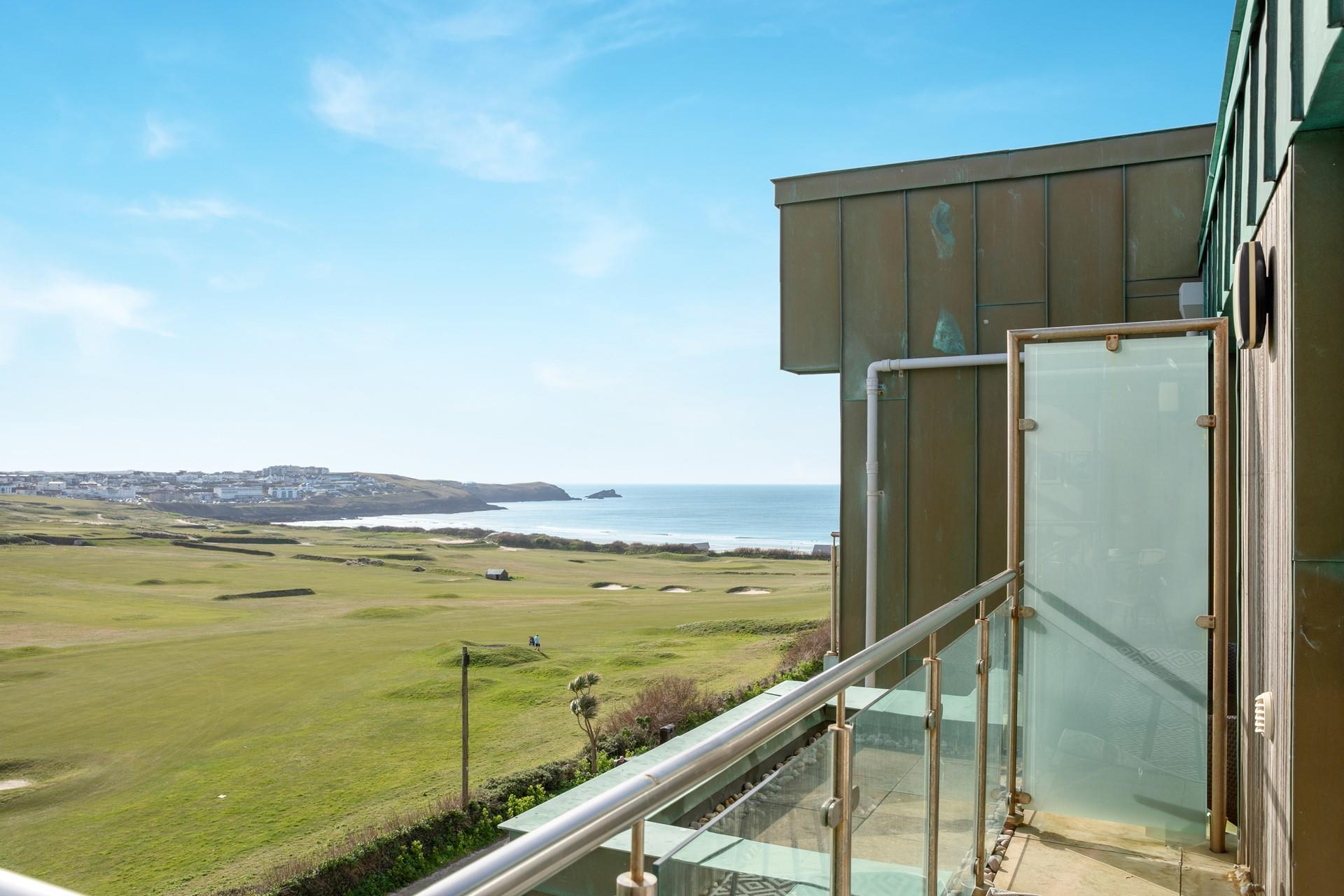 Take in the views of the golf course and the beach from the balcony.