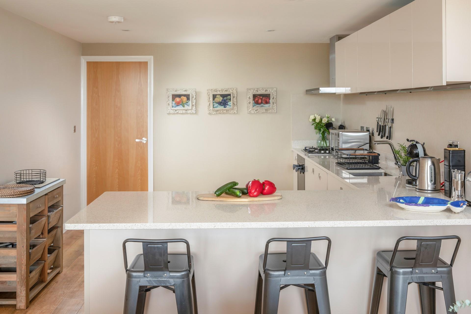 There is a bedroom just beyond the kitchen, ideal for the early risers who want to get up and make a hearty breakfast.