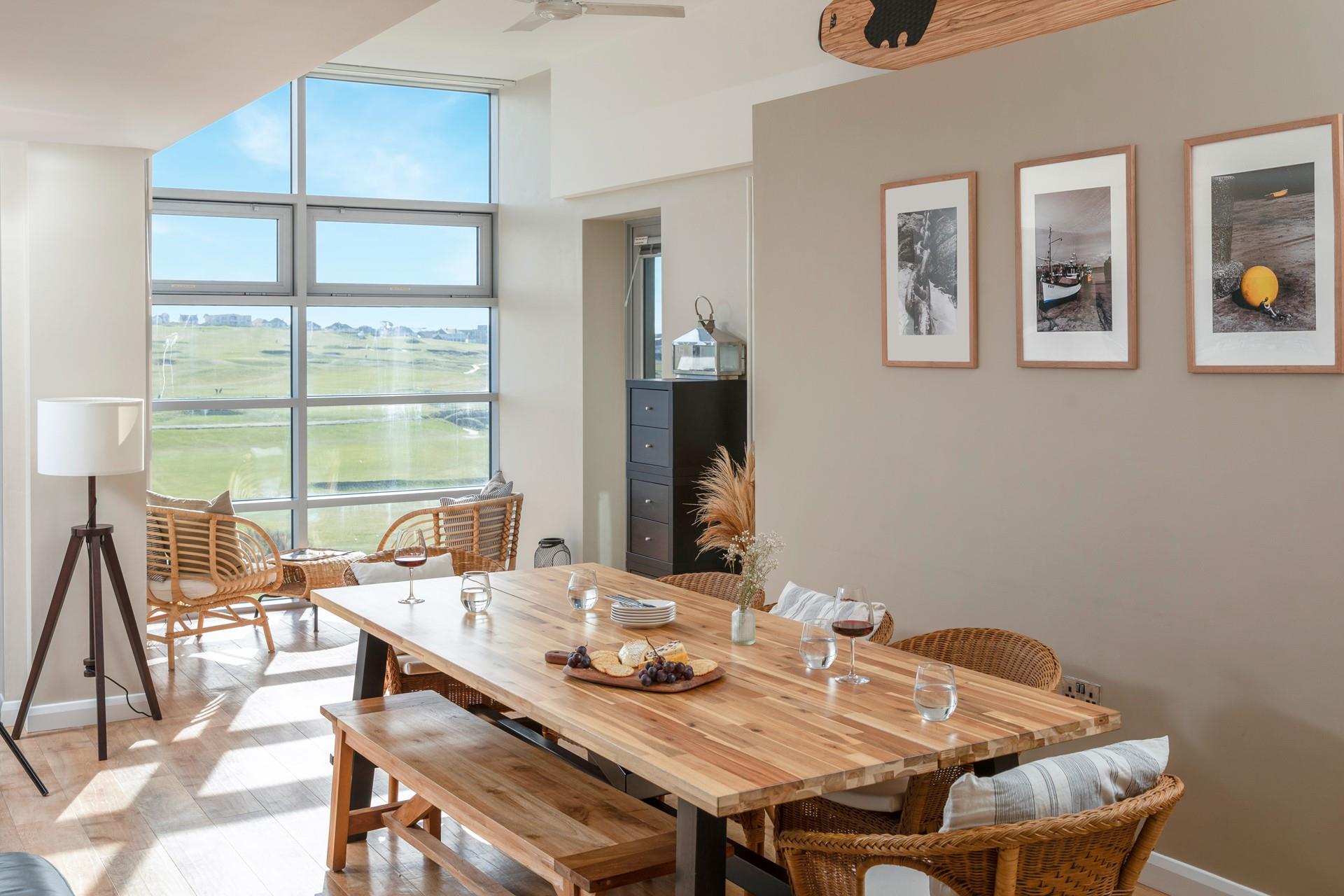 Dine together as a family in the spacious open plan living space, filled with natural light and warmth on a summer's day.