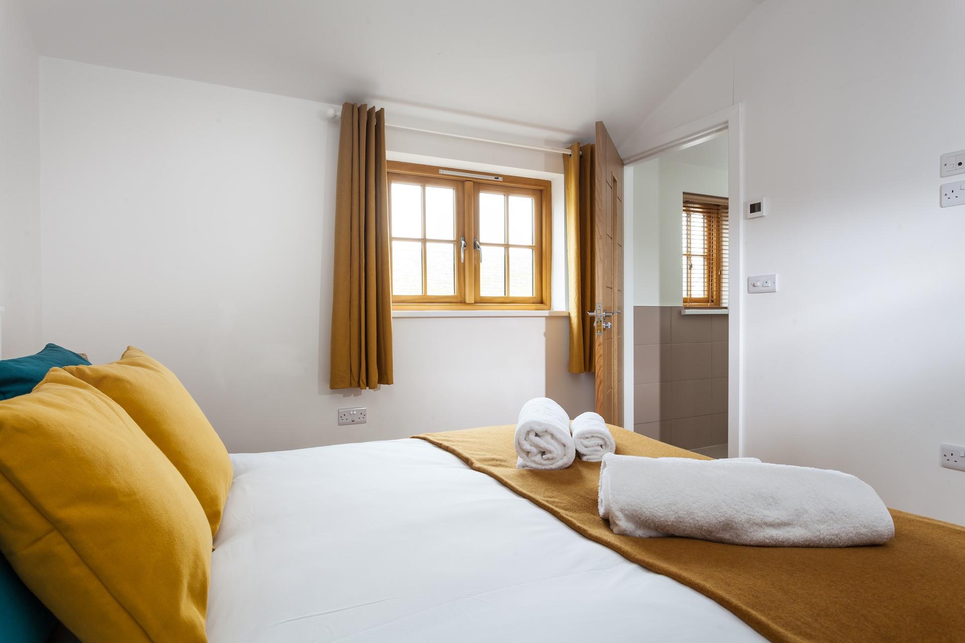 Climb out of bed and wander into the en suite to get ready for the day.