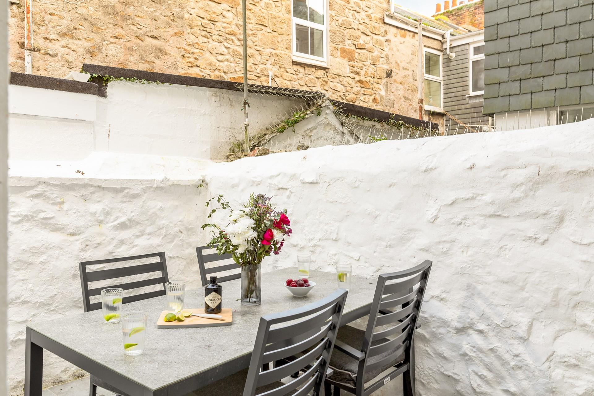 Enjoy a cold G and T in the outside courtyard.