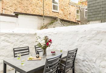 Enjoy a cold G and T in the outside courtyard.