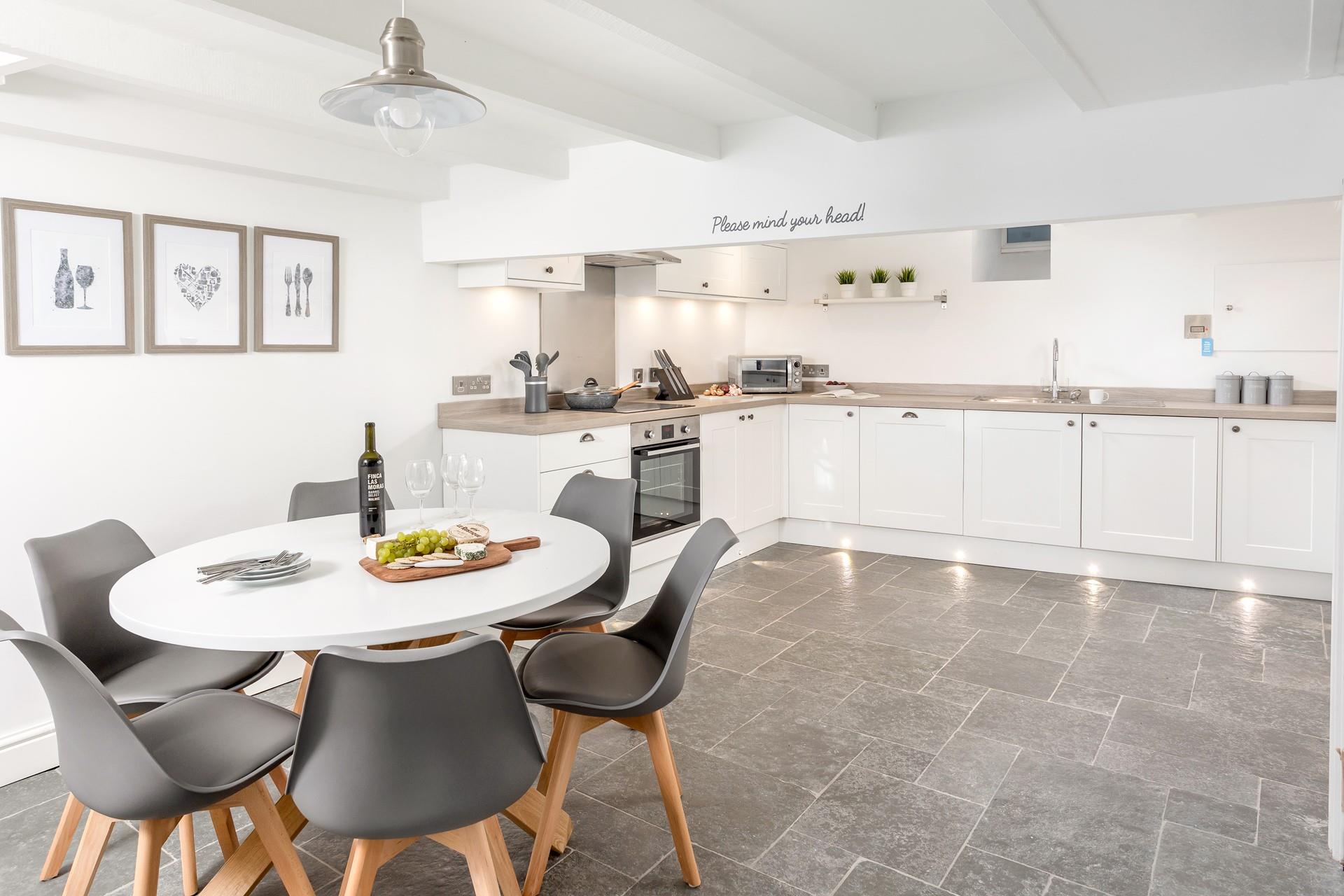 The large kitchen space is light and airy and is well-equipped for you to rustle up a delicious meal.