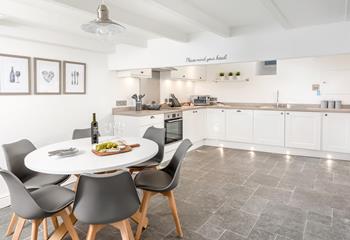 The large kitchen space is light and airy and is well-equipped for you to rustle up a delicious meal.