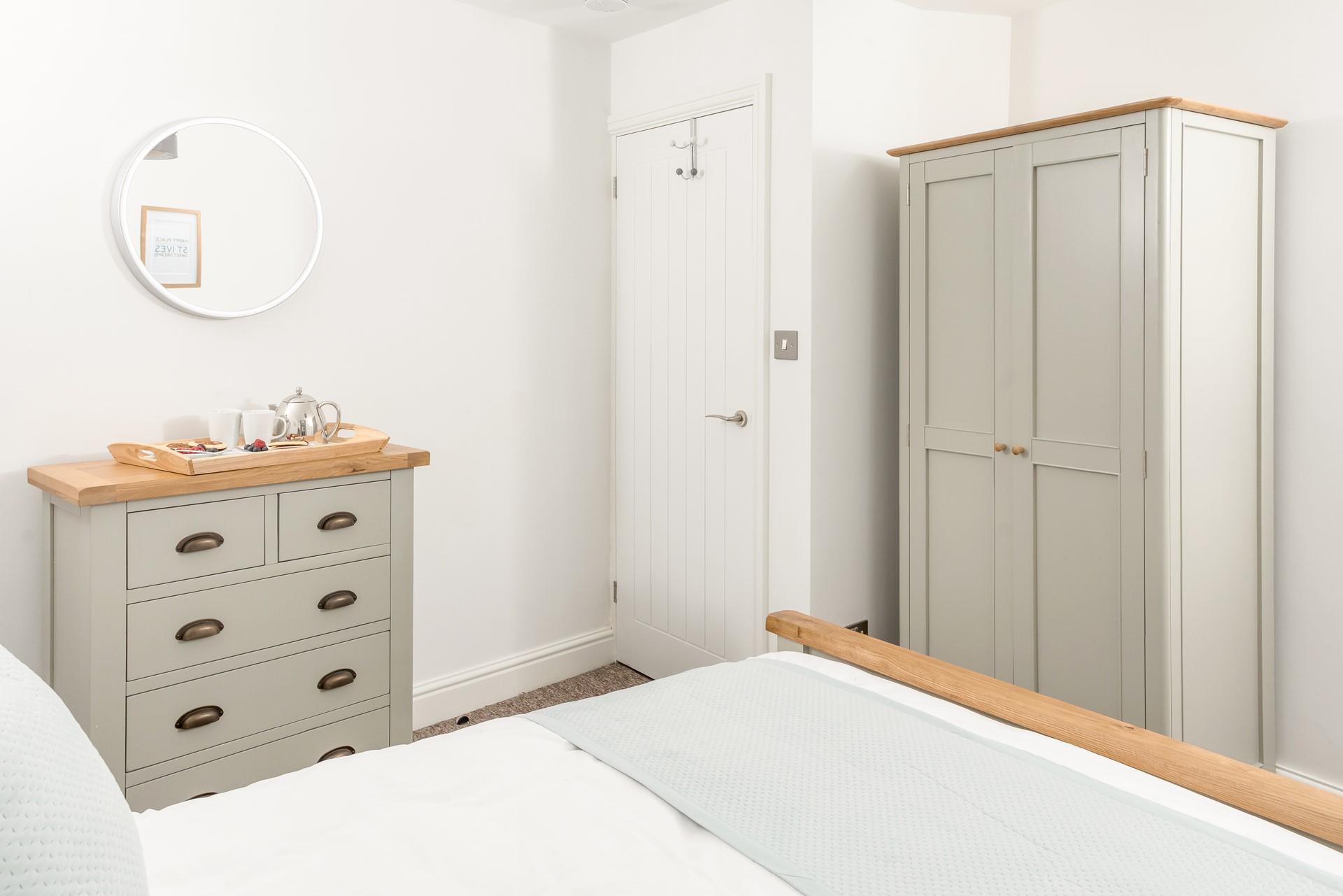 Bedroom 1 has beautiful furnishings for you to unpack all your clothes into.