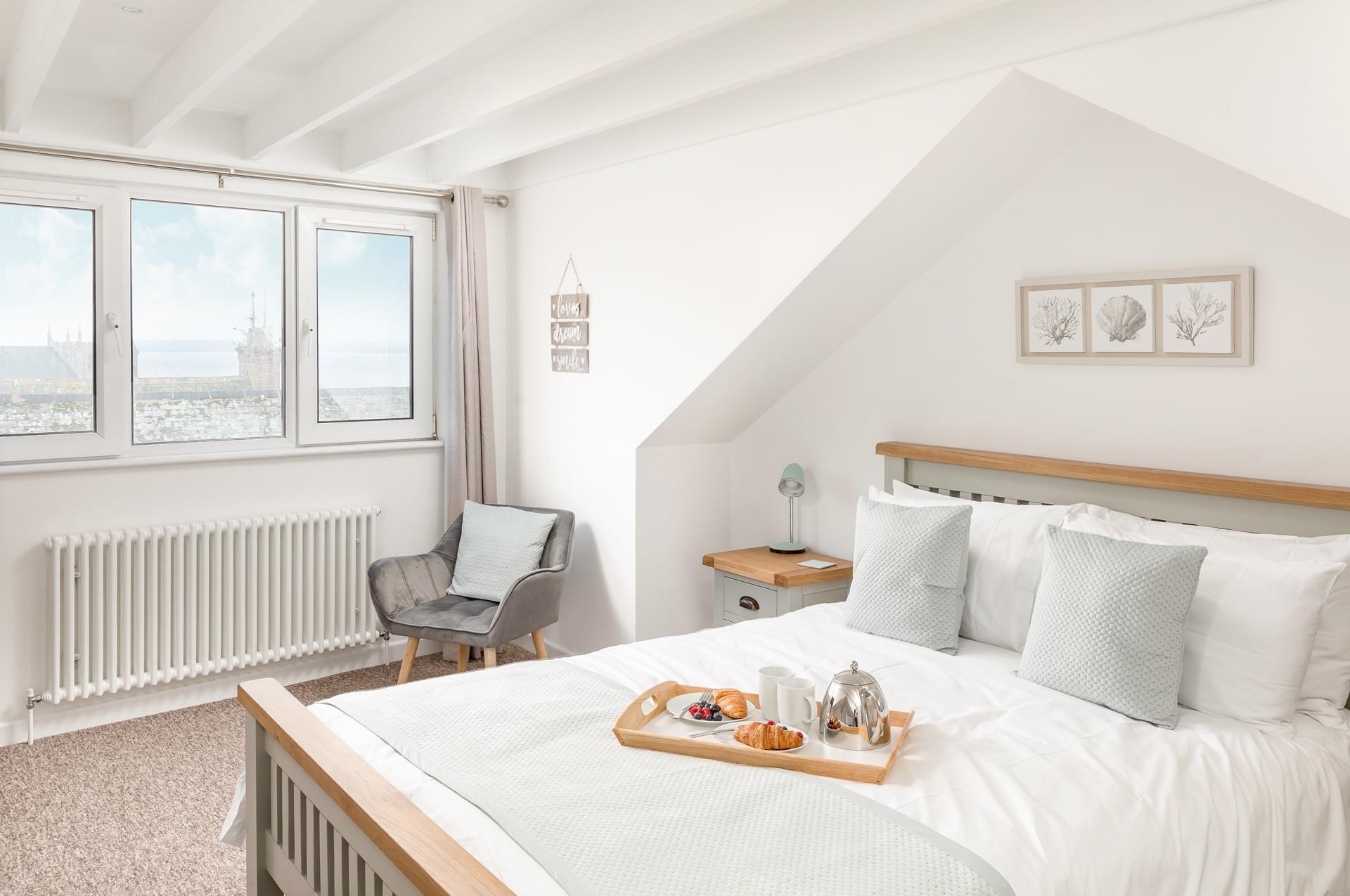 Bedroom 3 has a king size bed and sea views to wake up to.