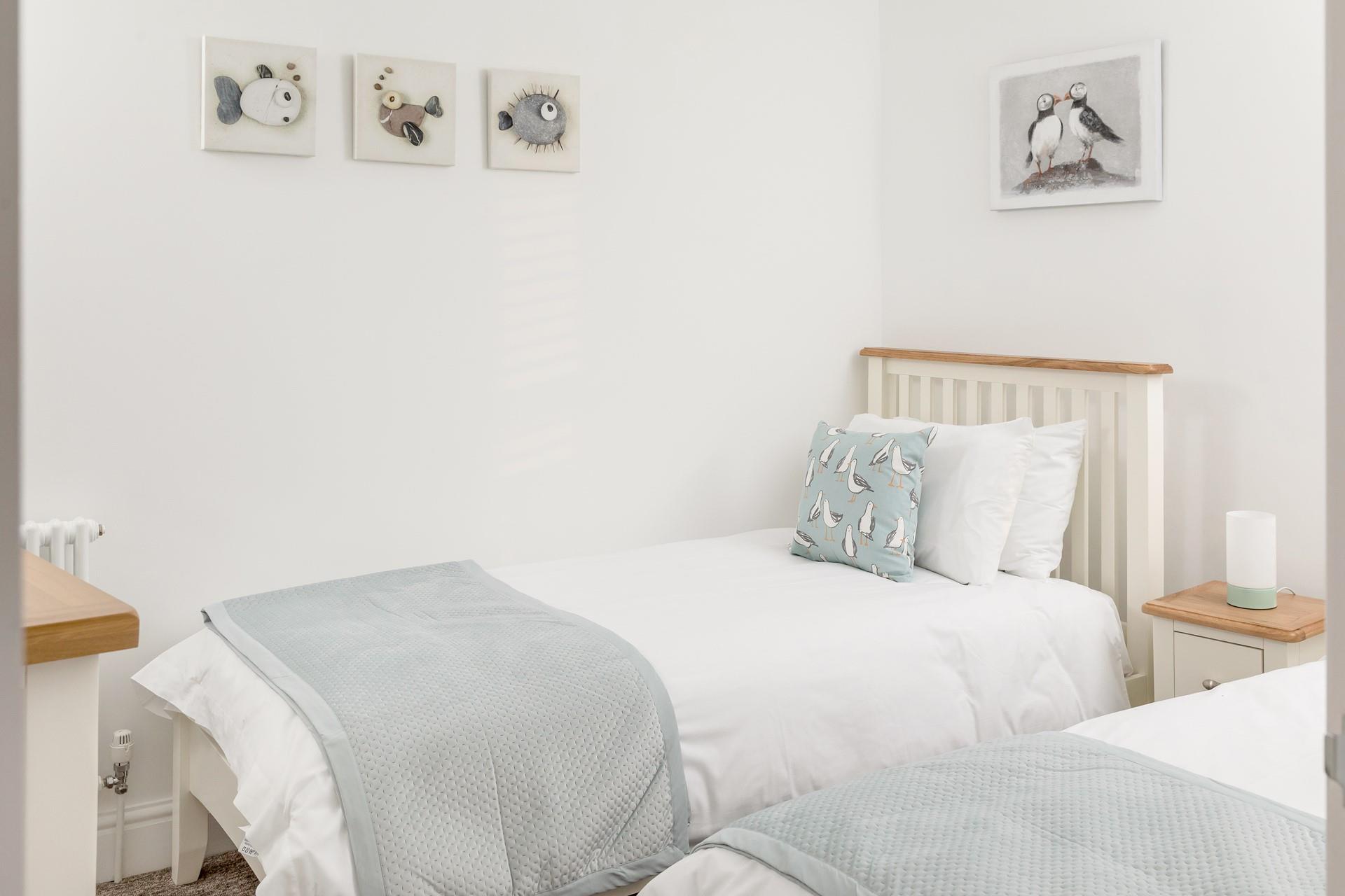 The kids will love the quirky artwork in the twin bedroom.