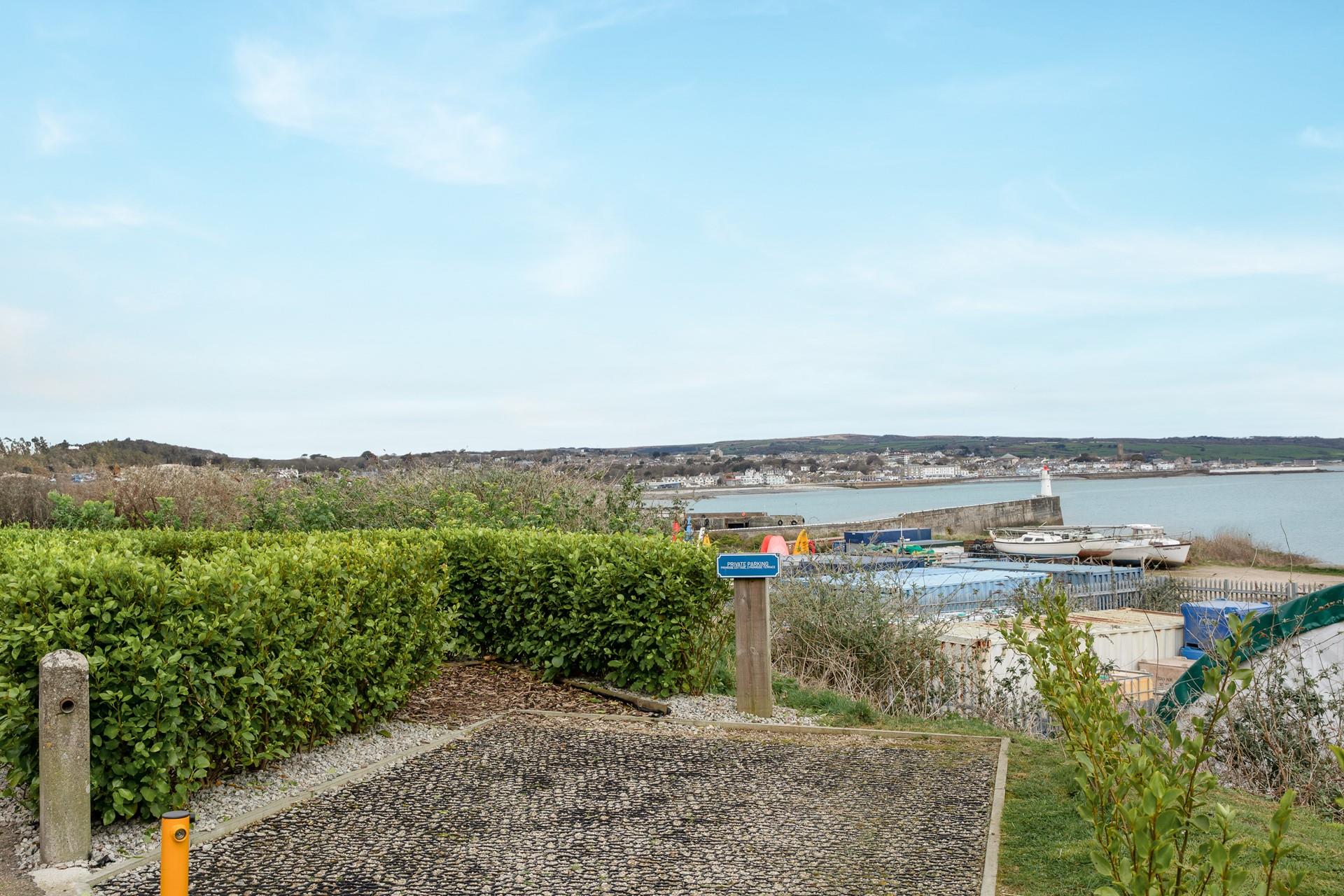 Even the parking space has a sea view at Primrose Cottage.