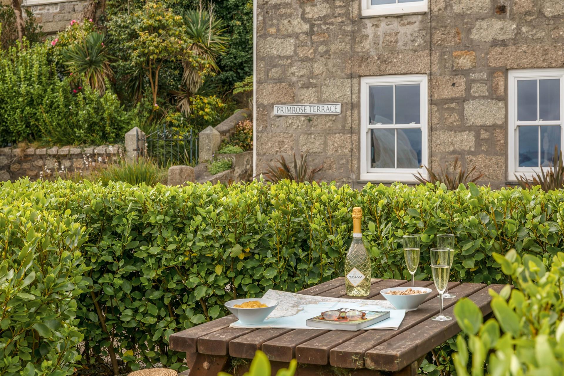 Pretty gardens surround the chocolate box cottage!