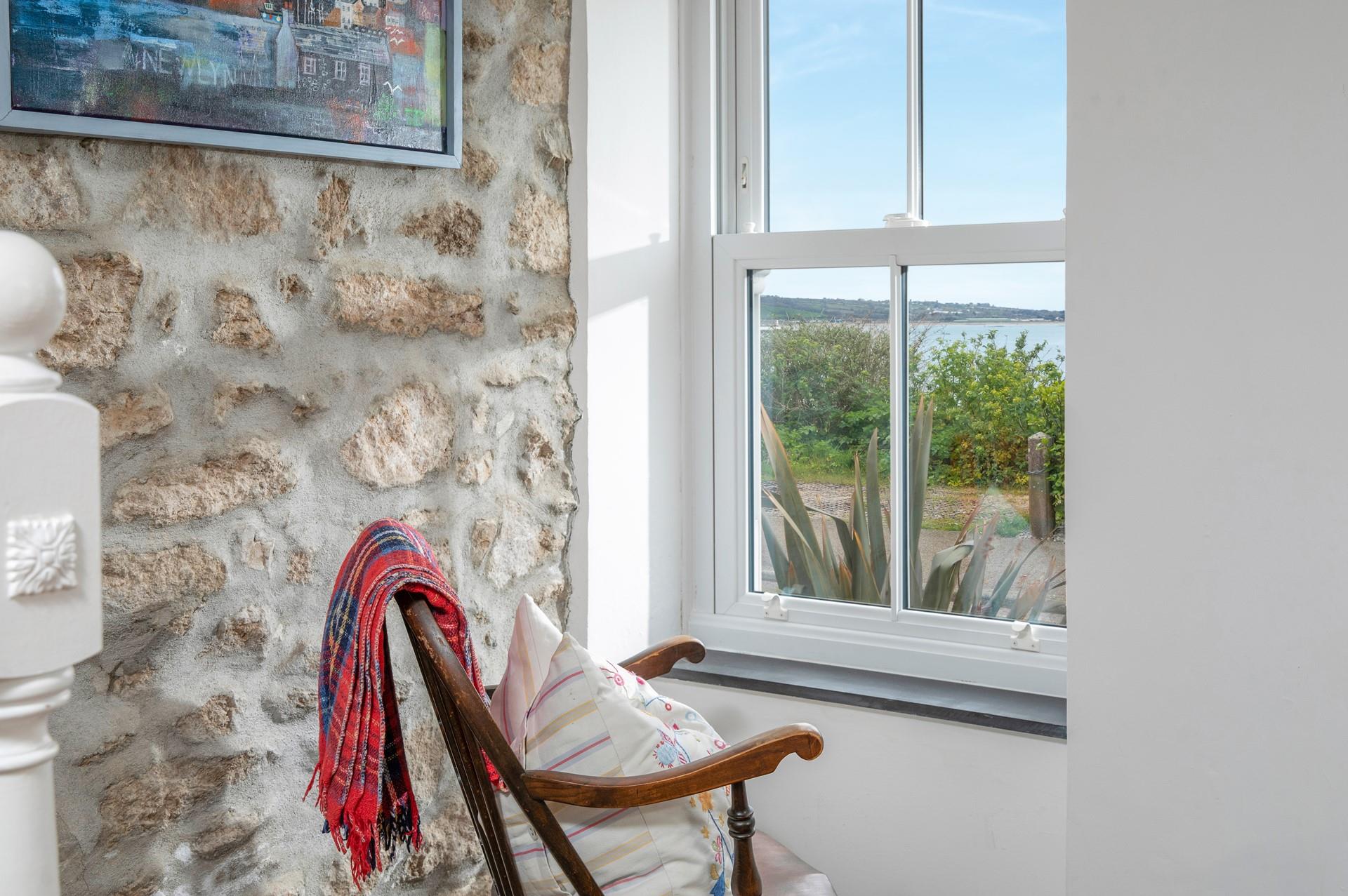 Beautiful cottage features and a sea view await!