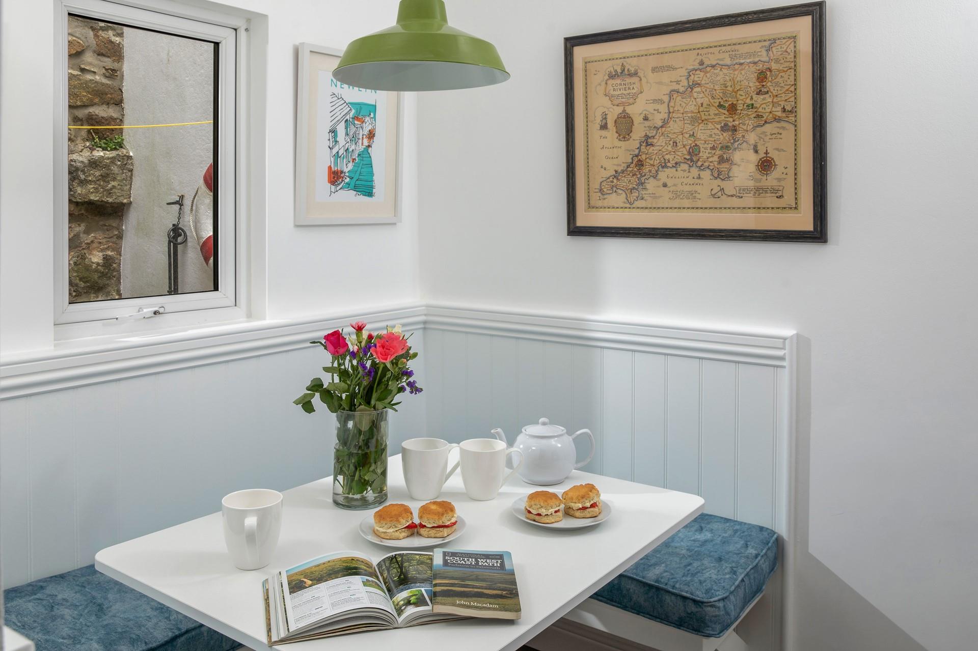Enjoy a spot of afternoon tea around the dining table after a morning walk along the coast.