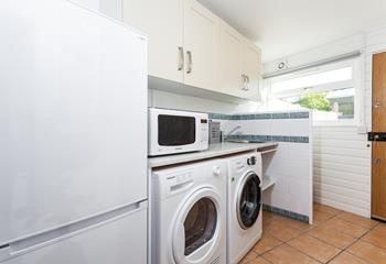 Separate utility room with everything you need during your holiday including microwave, fridge freezer, washing machine and tumble dryer. 
