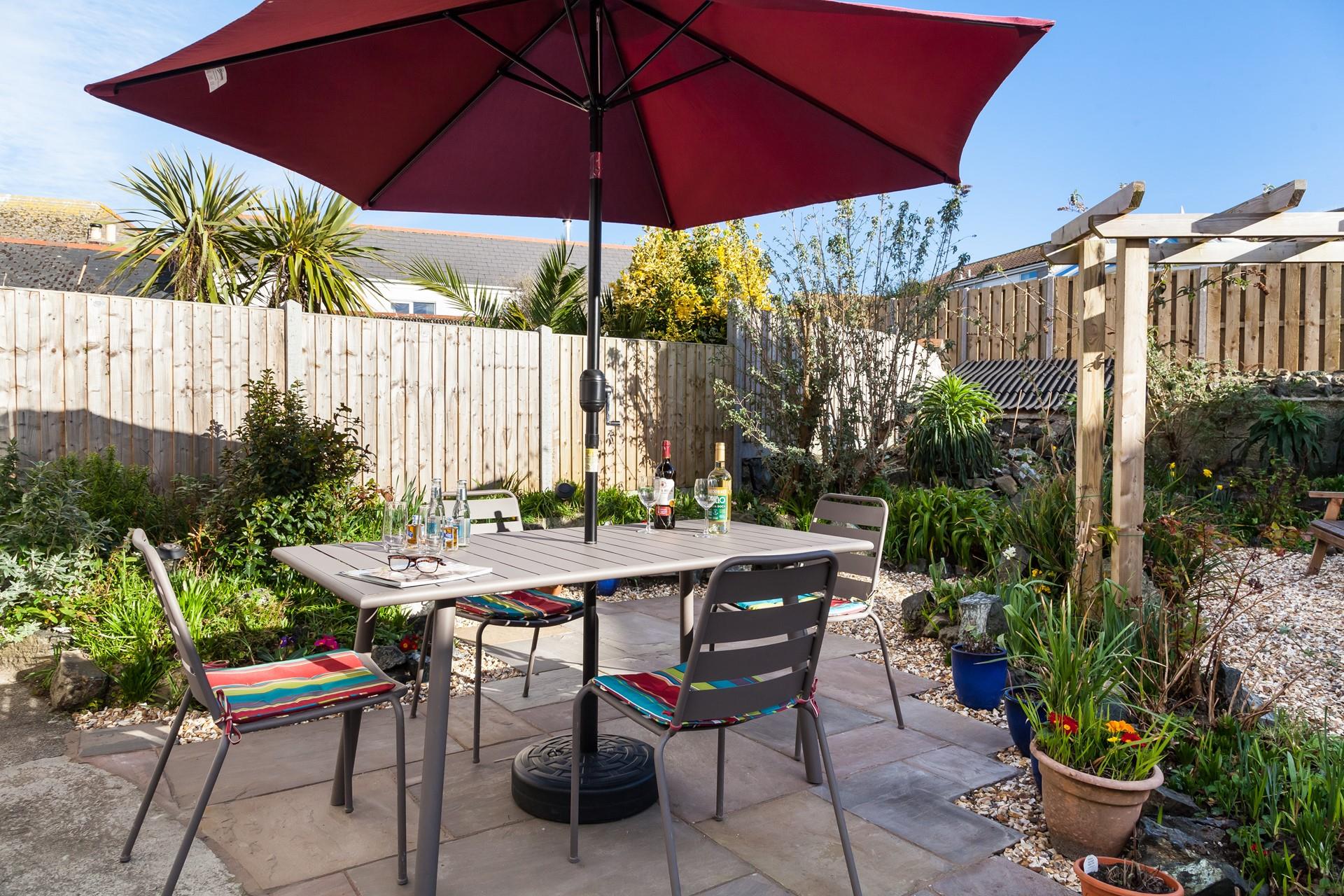 Dine al fresco, surrounded by bright seasonal flowers.
