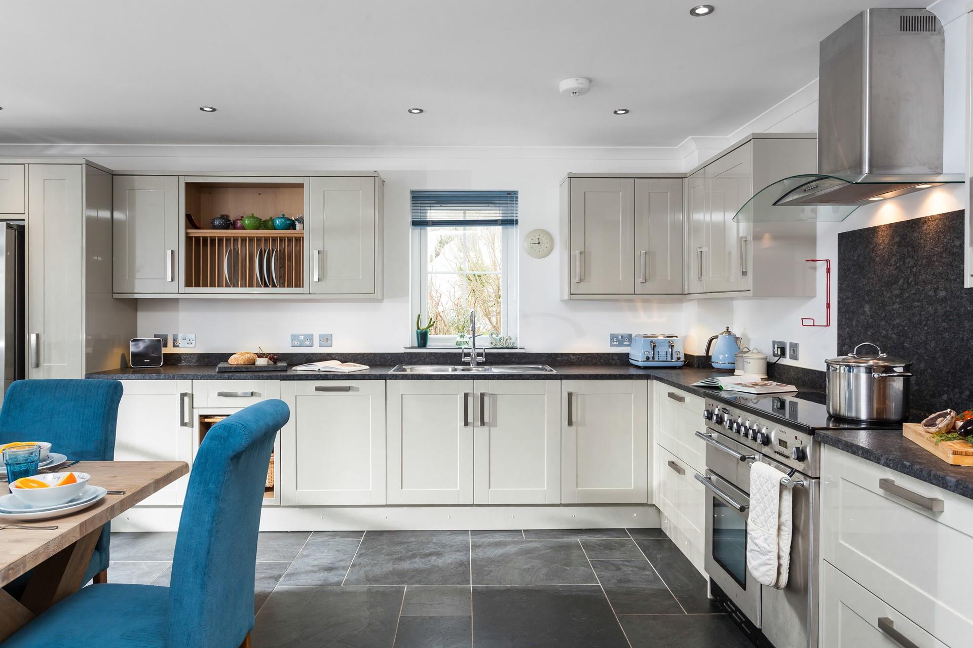 Cook up a storm in this sleek and spacious, open plan kitchen. 
