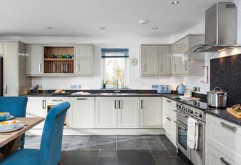 Cook up a storm in this sleek and spacious, open plan kitchen. 