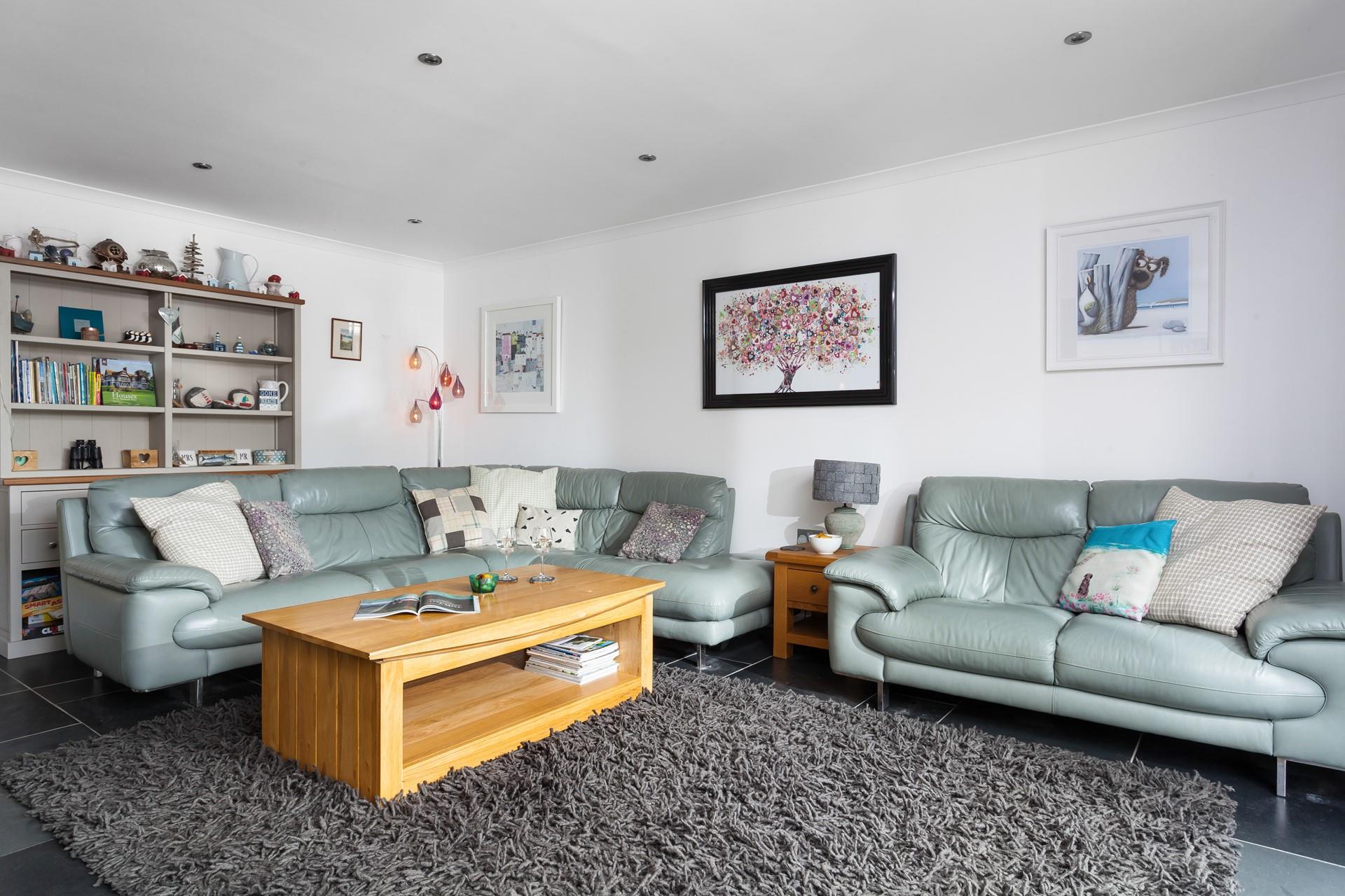 There is room for all of the family in this cosy sitting room. 