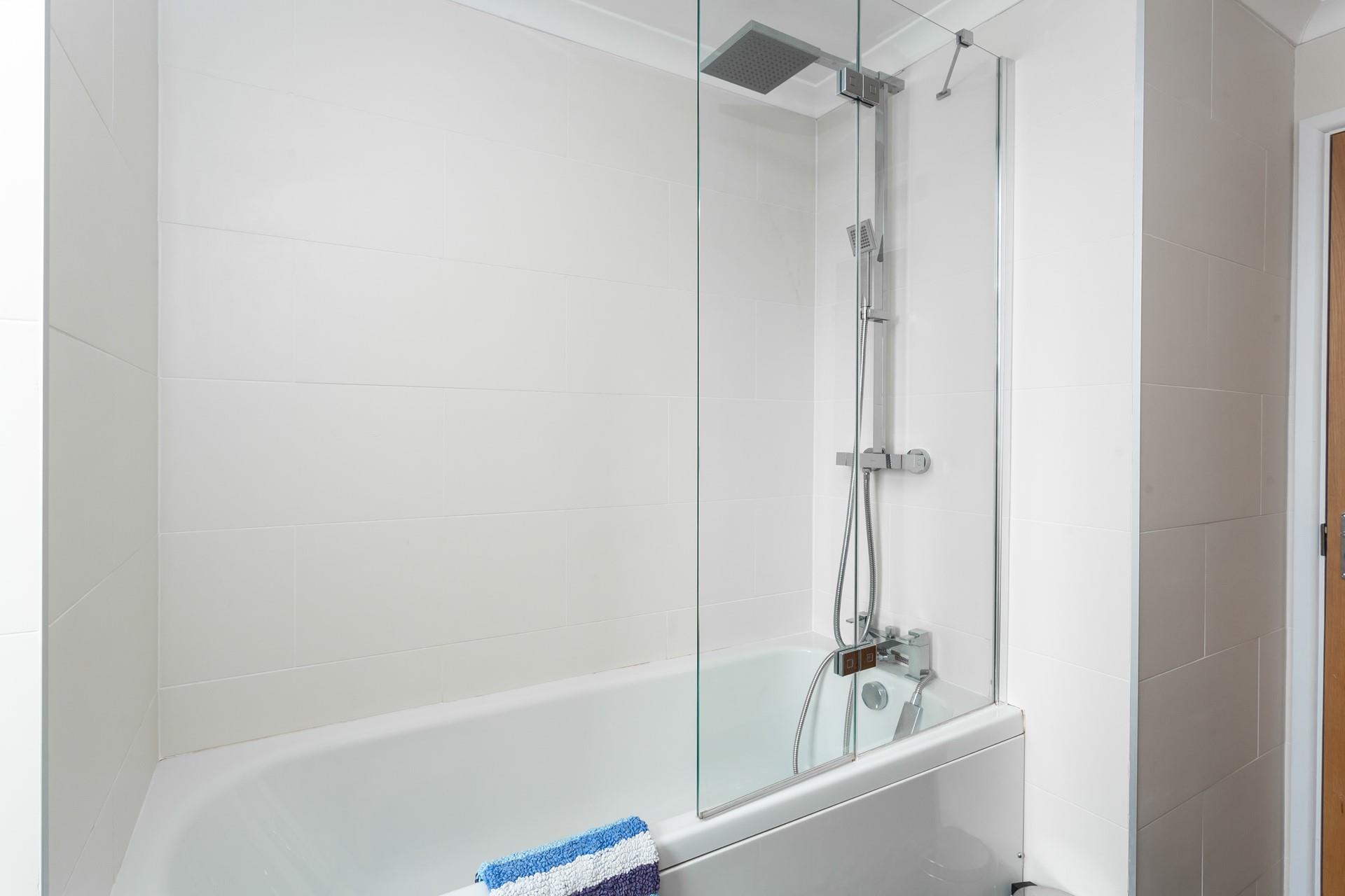 Wash off sandy toes in the shower after a day on the beach.