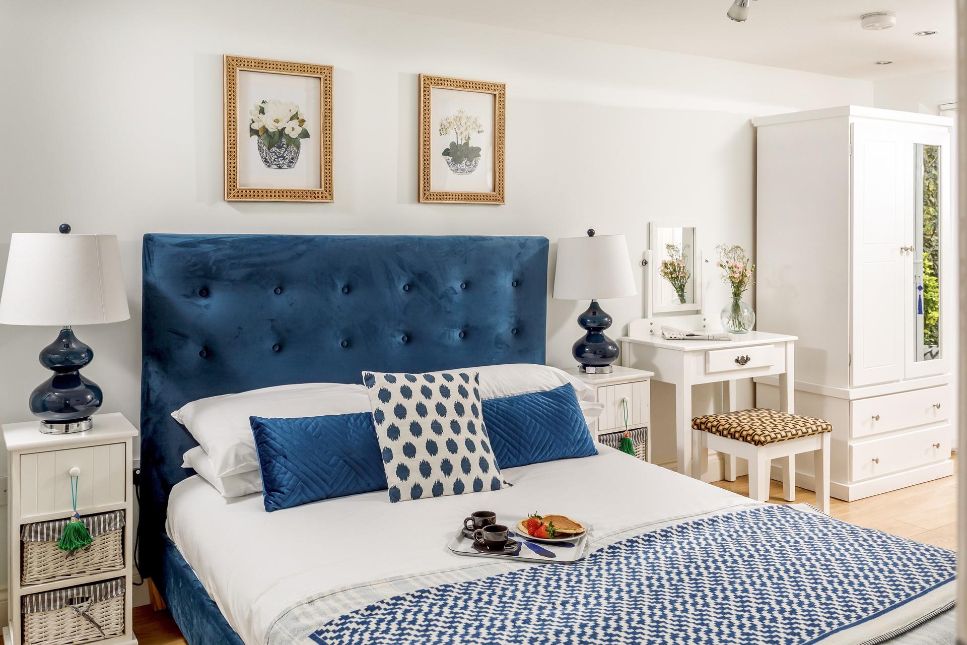 The spacious king size bed offers a restful night's slumber.