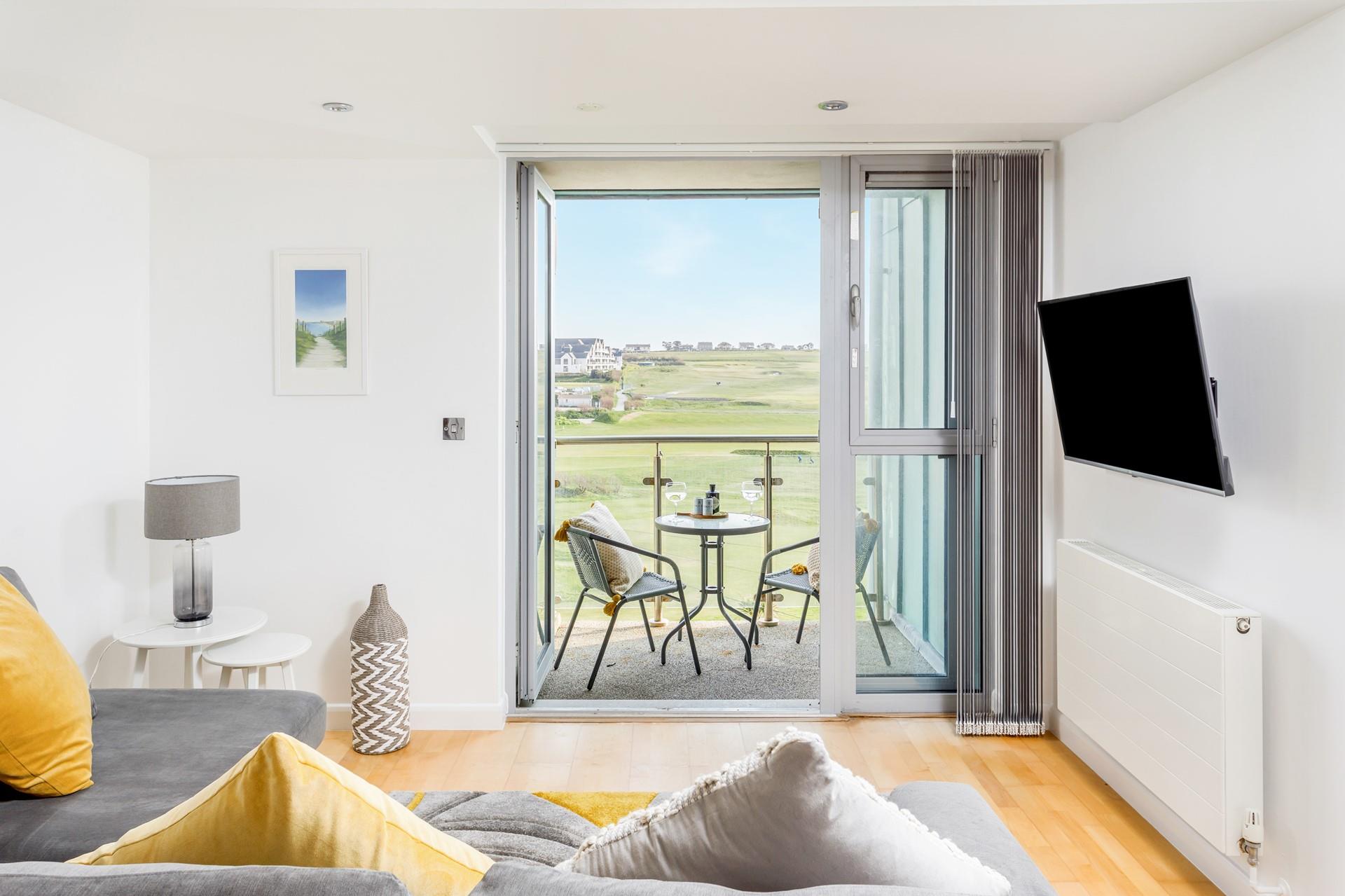 Sit with the balcony doors open and let the fresh, sea breeze drift through the apartment. 