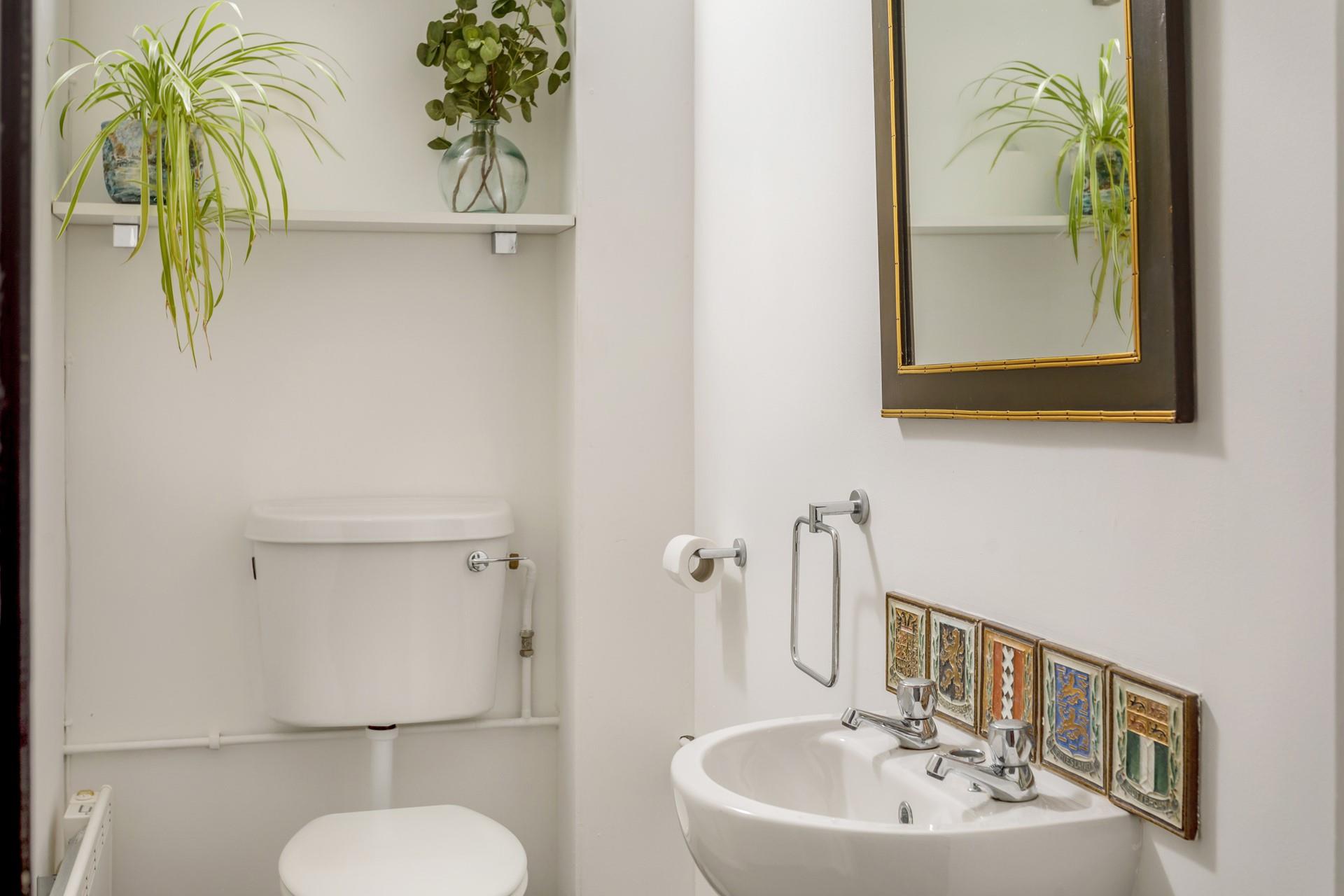 The handy downstairs cloakroom has a WC and basin.