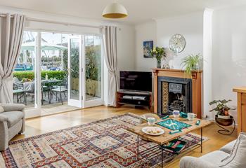 The spacious sitting room has double doors to let the fresh morning breeze in.