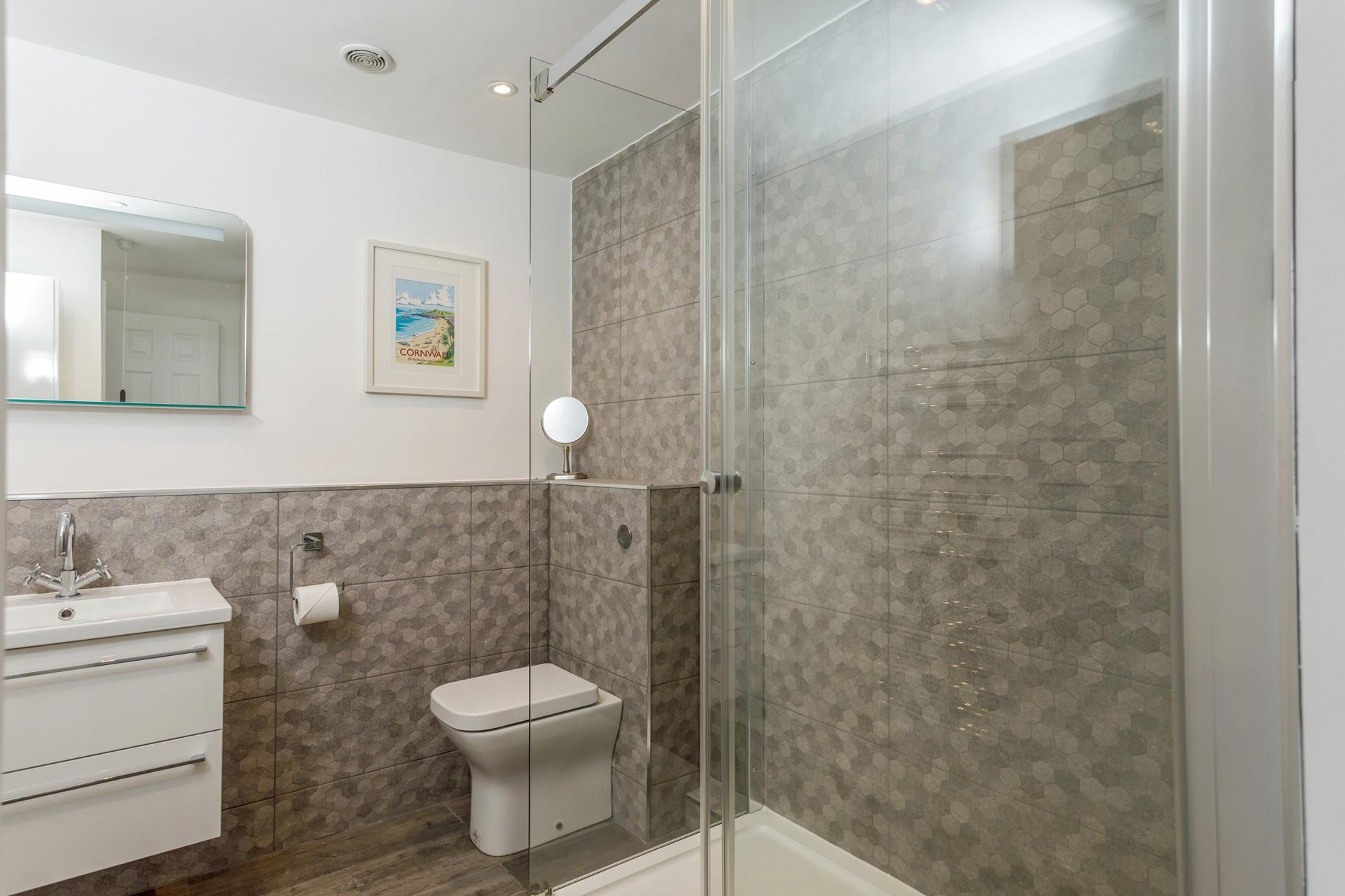Get ready for the day in the modern en suite.