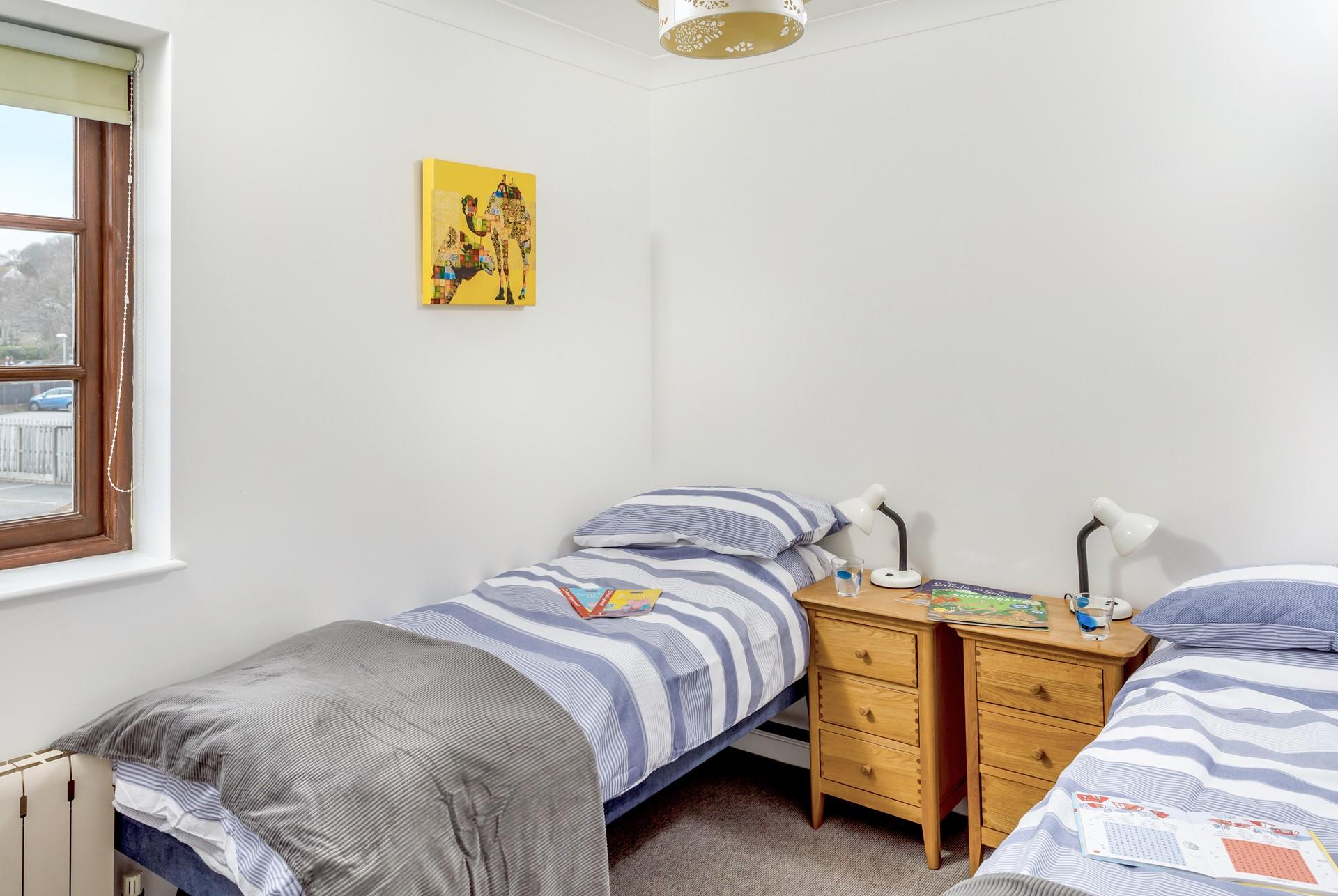 Twin beds are perfect for the children.