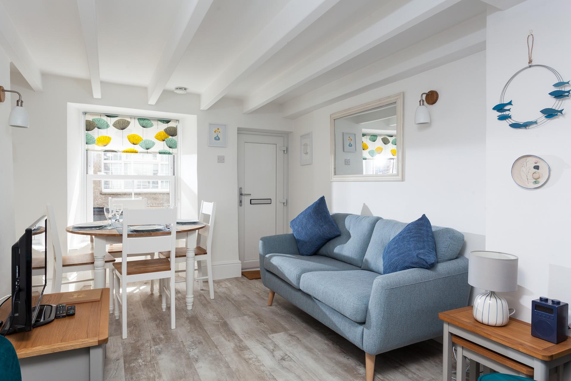 Cosy open plan living with colours reflecting the nearby seaside.