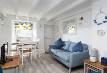 Cosy open plan living with colours reflecting the nearby seaside.
