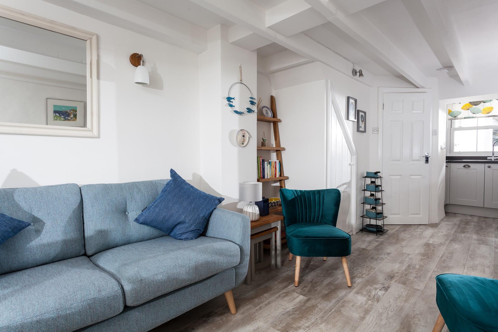Living space with door to inner hall with stairs to bedrooms and bathroom.