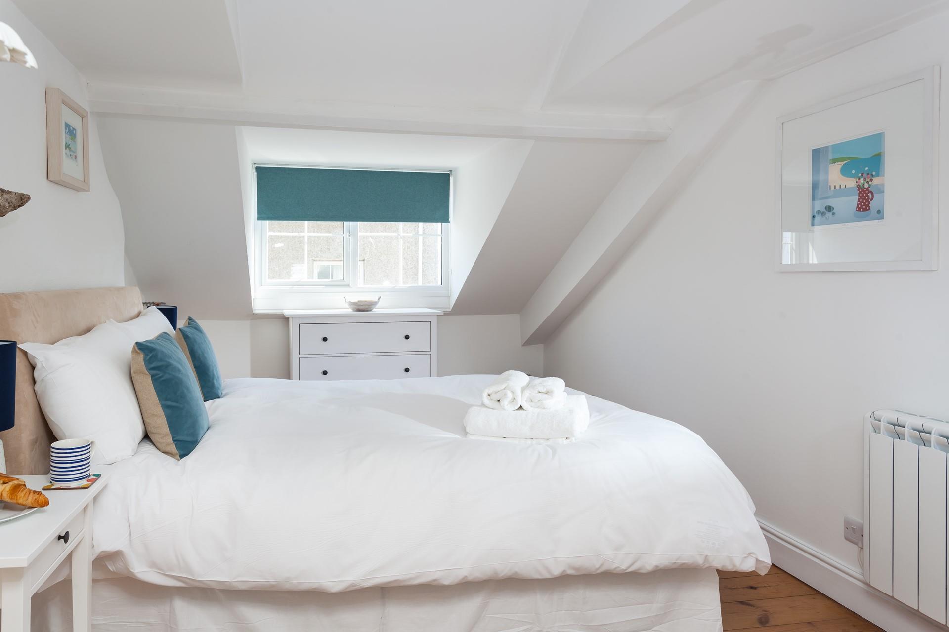 The master bedroom is spacious with dual aspect windows.