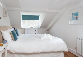 The master bedroom is spacious with dual aspect windows.