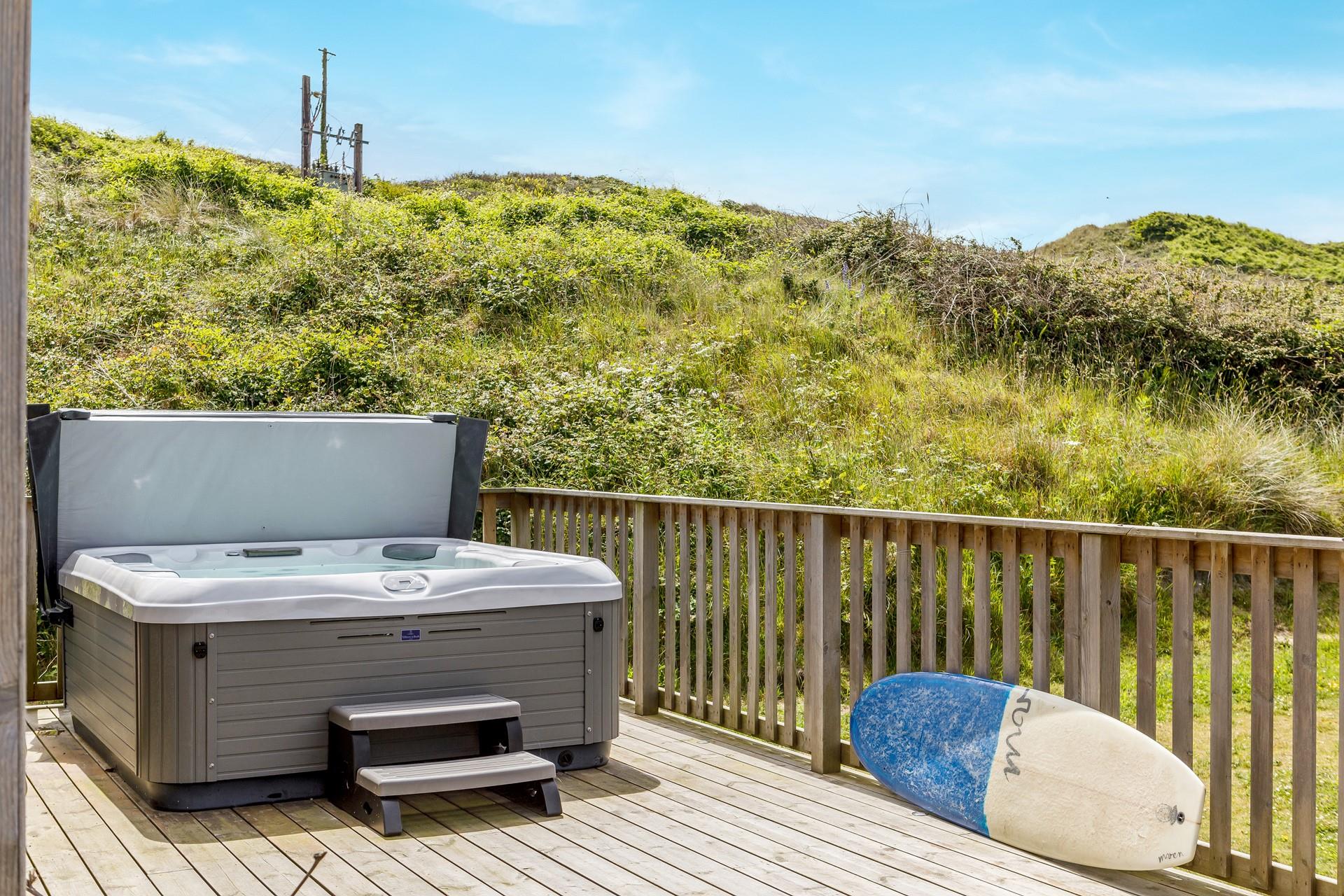 The hot tub is a great addition to the property, perfect for sunset watching or on chilly winter afternoons.