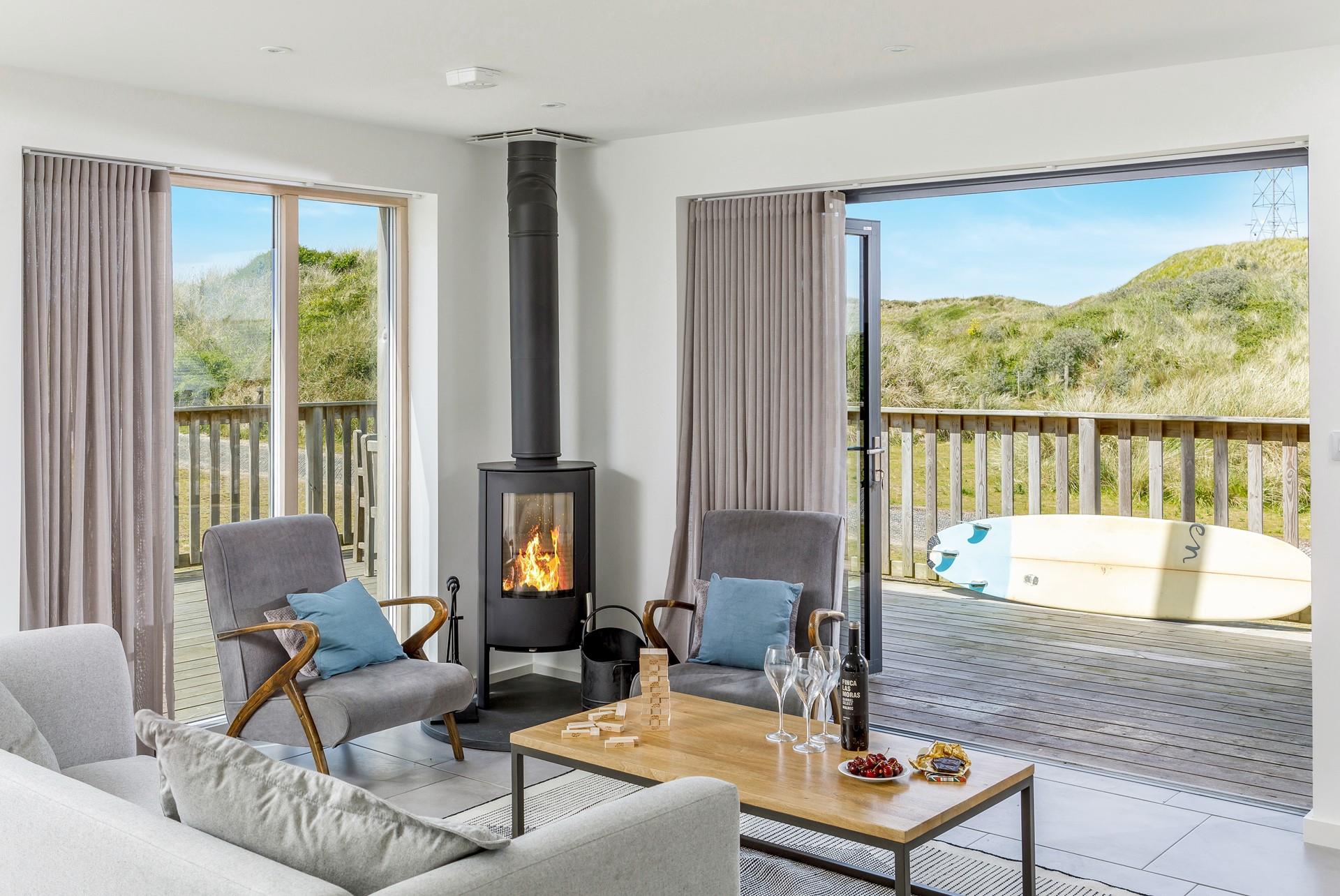 Relaxation is guaranteed at this luxurious beach house complete with stylish furnishings and a cosy woodburner.