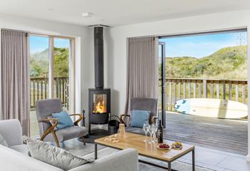 Relaxation is guaranteed at this luxurious beach house complete with stylish furnishings and a cosy woodburner.
