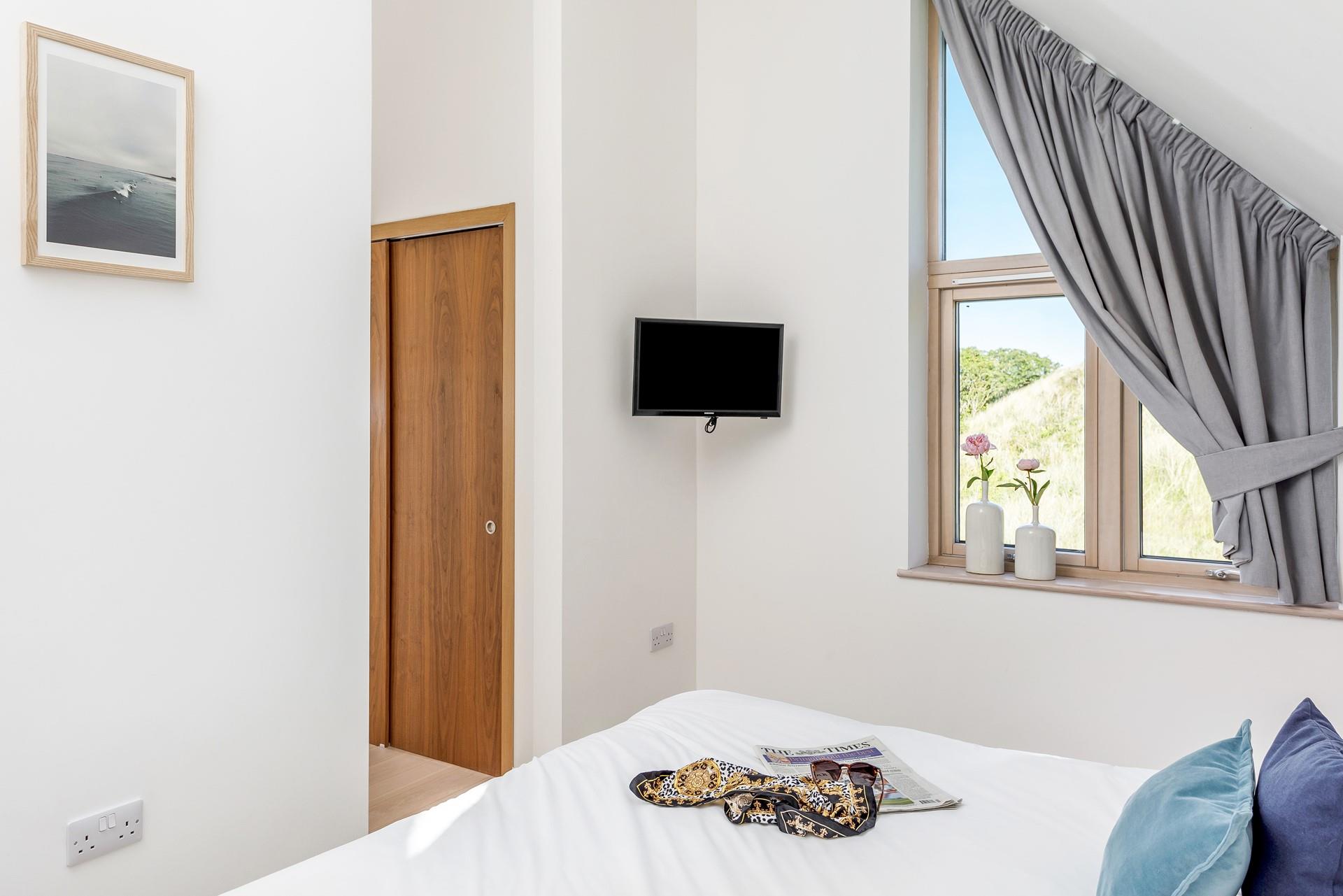 Watch the sunset down on the beach and then head back to snuggle into bed.