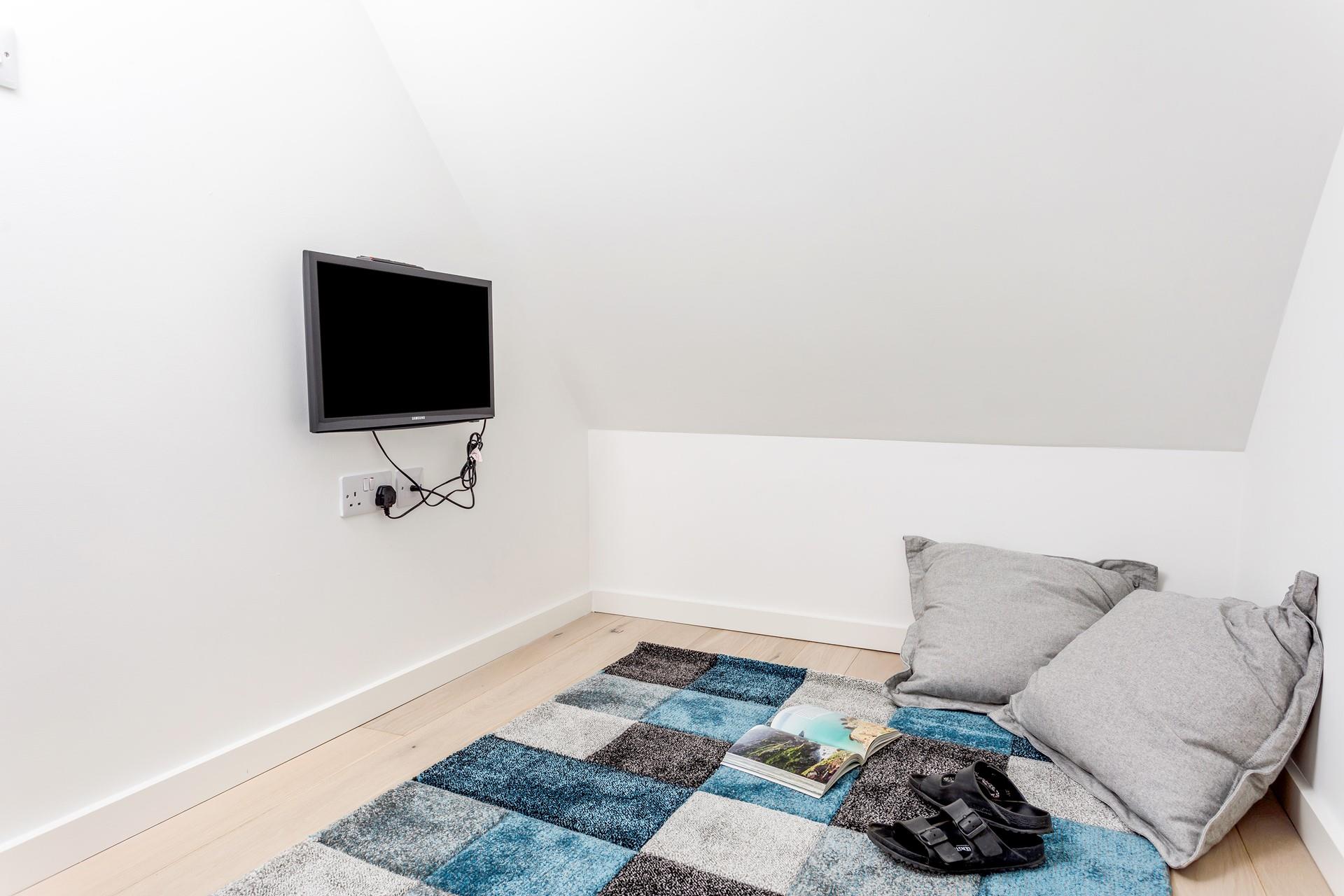 The snug is a great space for kids to relax whilst the adults put their feet up in the sitting room.