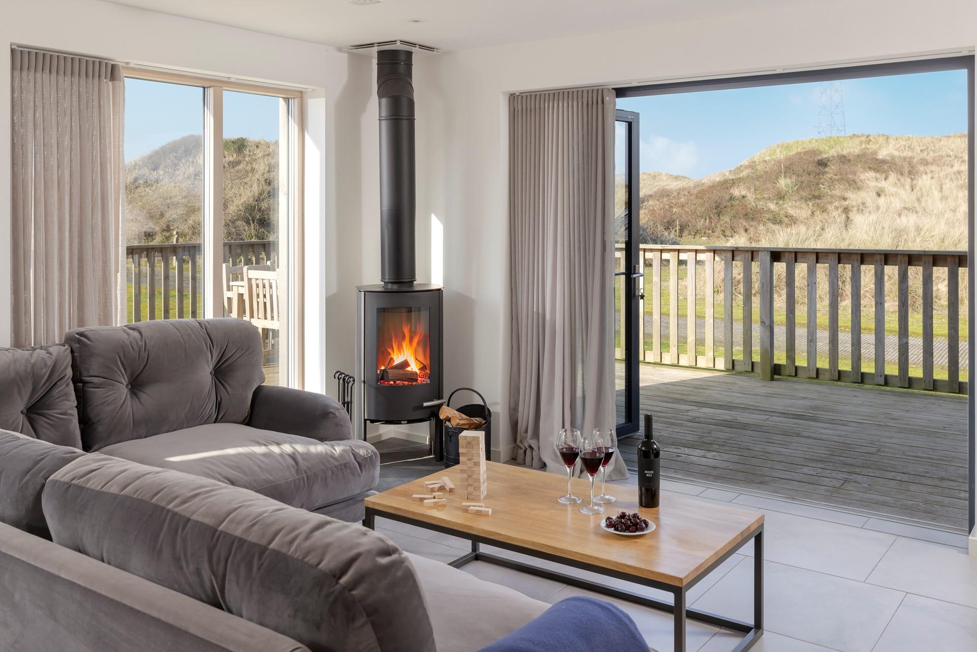 Relaxation is guaranteed at this luxurious beach house, complete with stylish furnishings and a cosy woodburner.