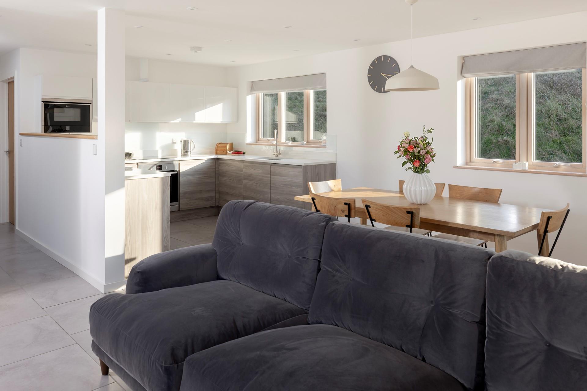 The open plan living space is spacious and light with room for the whole family to cook, dine and relax.
