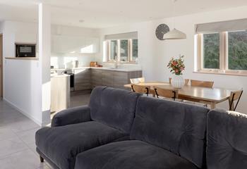 The open plan living space is spacious and light with room for the whole family to cook, dine and relax.