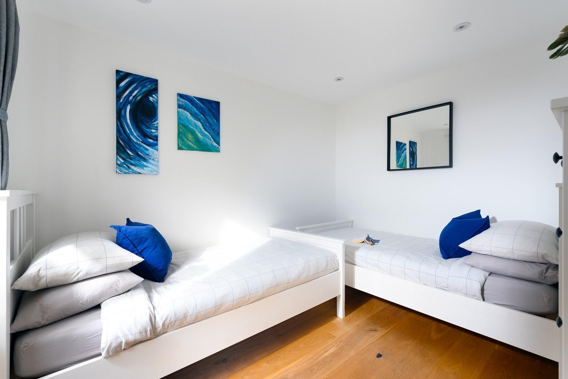 The twin room has a blue and white theme creating a cosy base to rest your head.