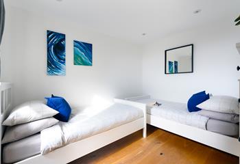 The twin room has a blue and white theme creating a cosy base to rest your head.