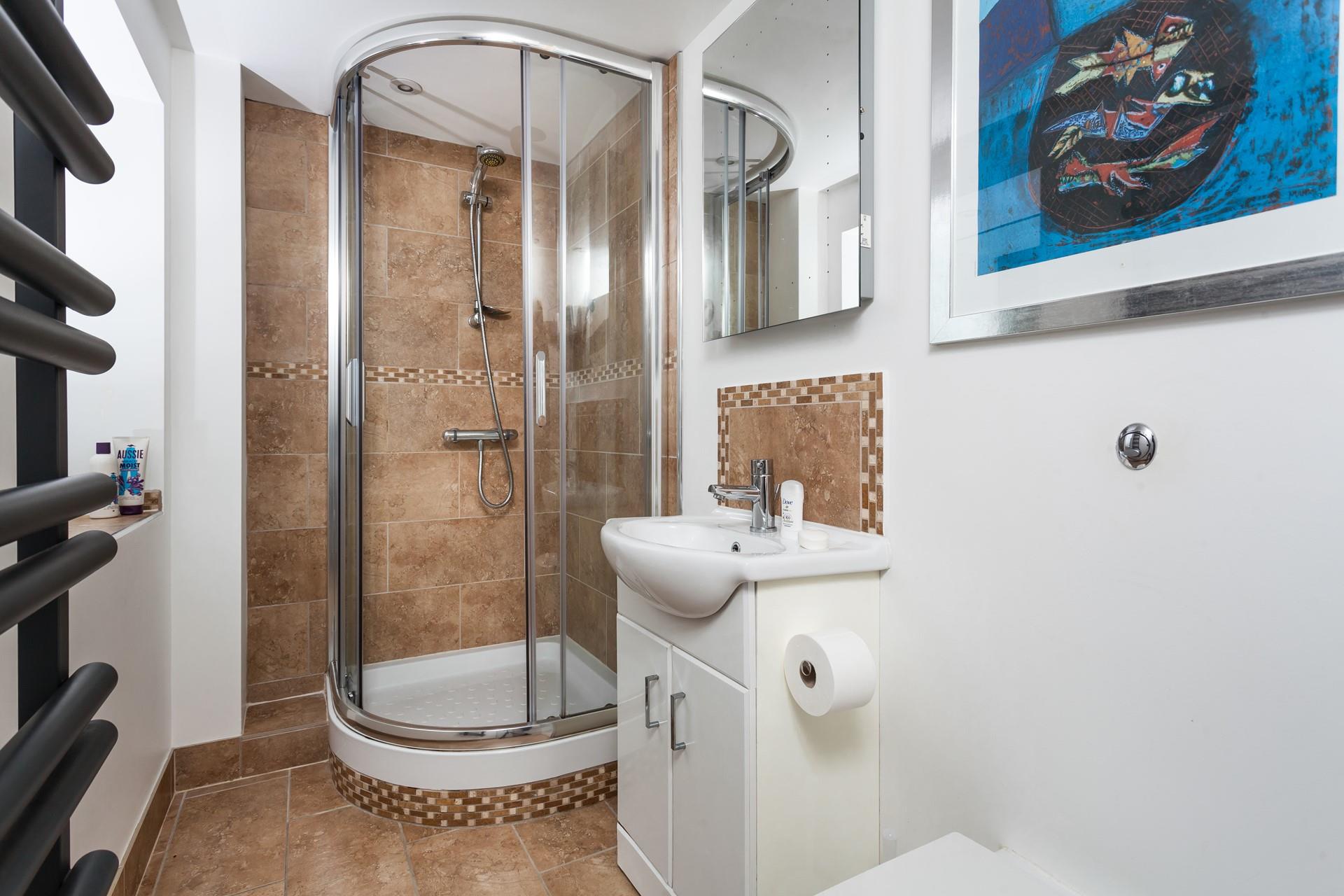 Wash off the sand in the modern bathroom and get ready for an evening stroll as the sun comes down.